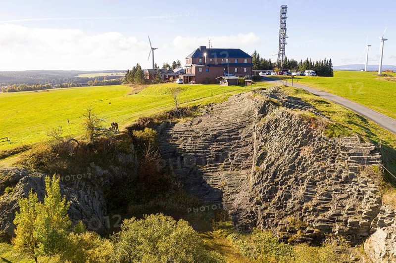 Basalt outcrop from a former quarry on the Hirstsein with mining hut, Erzgebirge, Marienberg Saxony, Germany, Europe