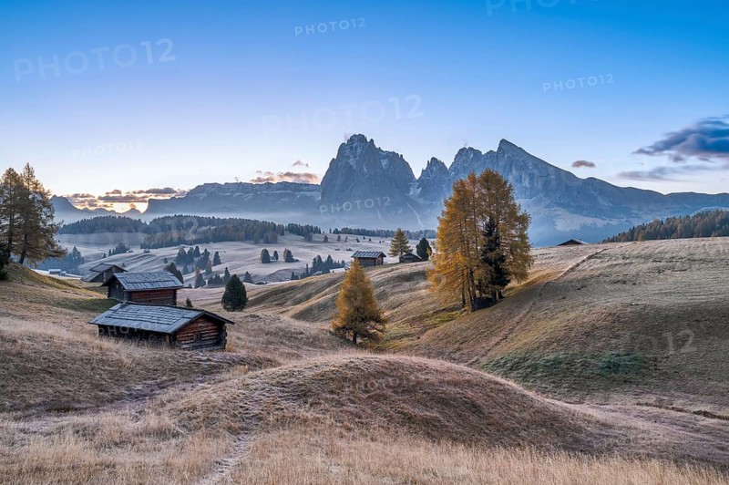 Autumn on the Seiser Alm, Alpine huts with Plattkofel and Langkofel, frost, fog, Dolomites, South Tyrol