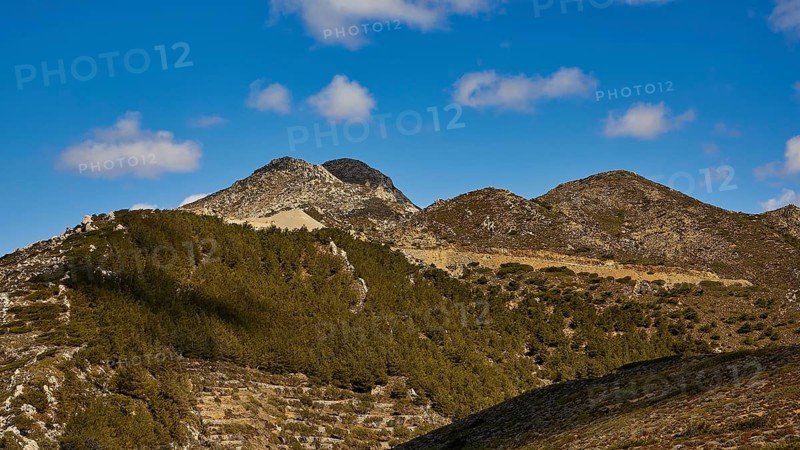 Mountain landscape with wooded hills and blue sky, Northern West Coast, Karpathos, Dodecanese, Greek Islands, Greece, Europe