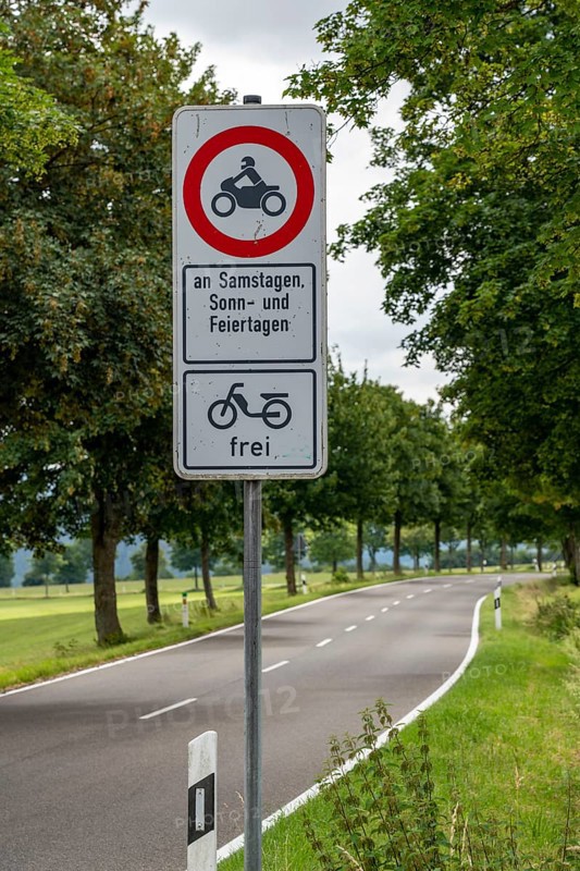 Prohibition sign, driving bans for motorbikes on weekends and public holidays, Eifel, Steckenborn, North Rhine-Westphalia, Germany, Europe