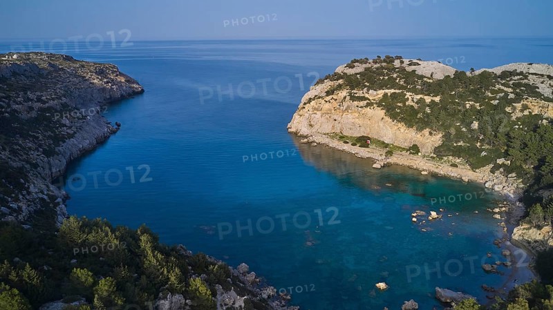 Drone shot, A picturesque, calm bay with crystal clear water and steep cliffs, surrounded by nature, Anthony Quinn Bay, Vagies Bay, Rhodes, Dodecanese, Greek Islands, Greece, Europe