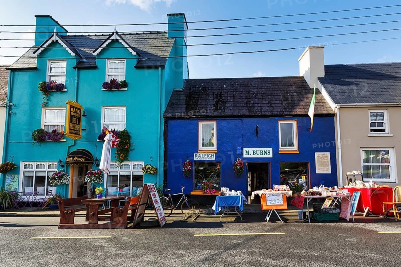 Flea market in front of colourful facades, Sneem, Ring of Kerry scenic road, Iveragh Peninsula, County Kerry, Ireland, Europe