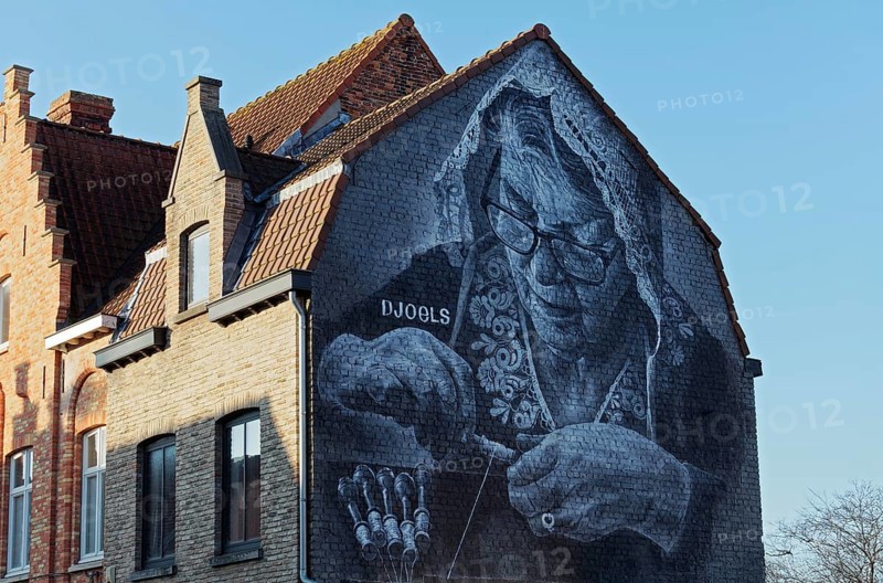 Mural lace maker with traditional lace bonnet, realistic mural in black and white by street artist Djoels, Bruges, West Flanders, Flanders, Belgium, Europe