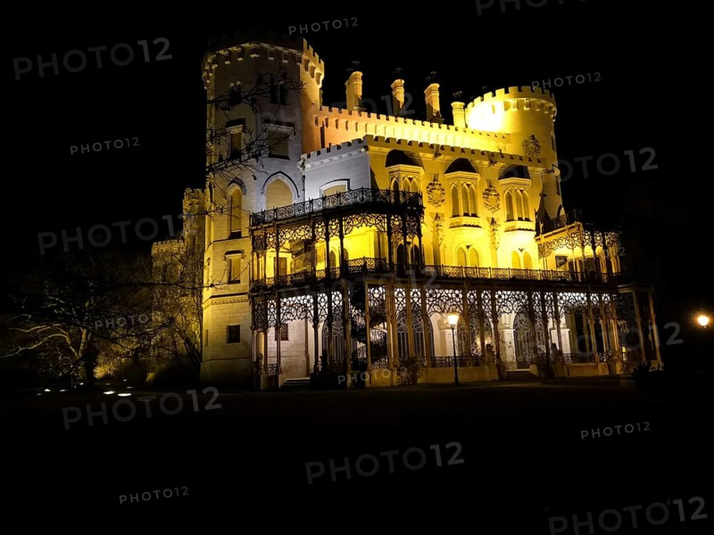 Illuminated castle at night. Hluboká is a historic château situated in Hluboká nad Vltavou. and is considered one of the most beautiful castles in the Czech Republic