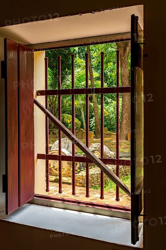 Open window of old colonial house with patio and garden in the historic city of Olinda, Olinda, Pernambuco, Brazil, South America