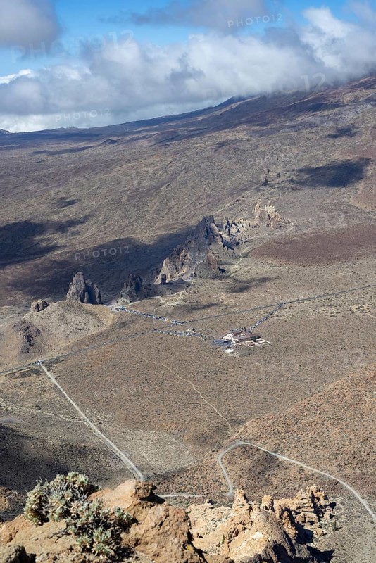 Panorama during the ascent to Alto de Guajara, 2715m, to the bizarrely shaped rock formations of volcanic rock, Roques de García, the visitor centre and the Hotel Parador, at sunrise, Teide National Park, Parque Nacional del Teide, Tenerife, Canary Islands, Spain, Europe