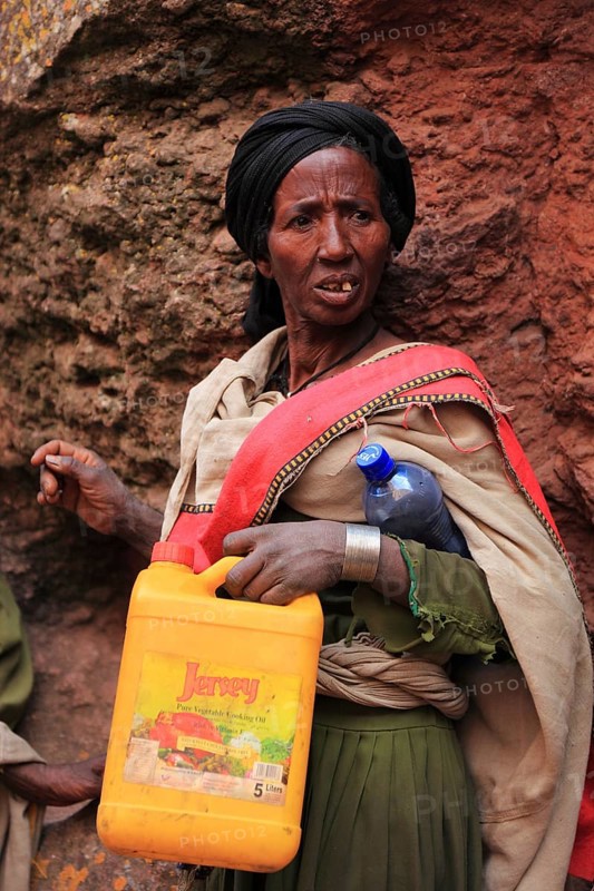 Pilgrim at the rock-hewn churches in Lalibela, container for holy water, Ethiopia, Africa