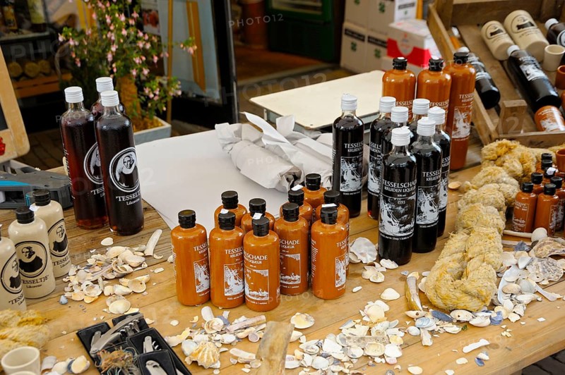 Market stall with typical liqueurs, shopping street, Den Burg, Texel Island, North Sea, North Holland, Netherlands