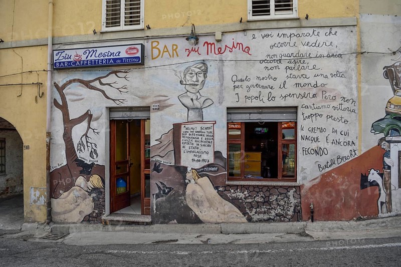 Mural on Ziu Mesina Bar, fight against Baader-Meinhof Gang, Red Army Fraction, Chancellor Helmut Schmidt, artist Francesco del Casino, Orgòsolo, Province of Nuoro, Sardinia, Italy, Europe