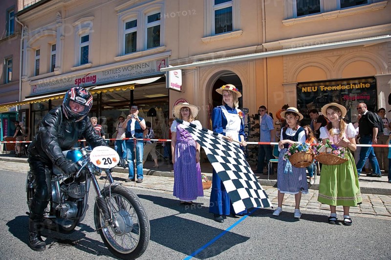 Sebnitz, town festival with classic car rally. The new flower girl Tina Häntzschel starts the motorbikes for the races