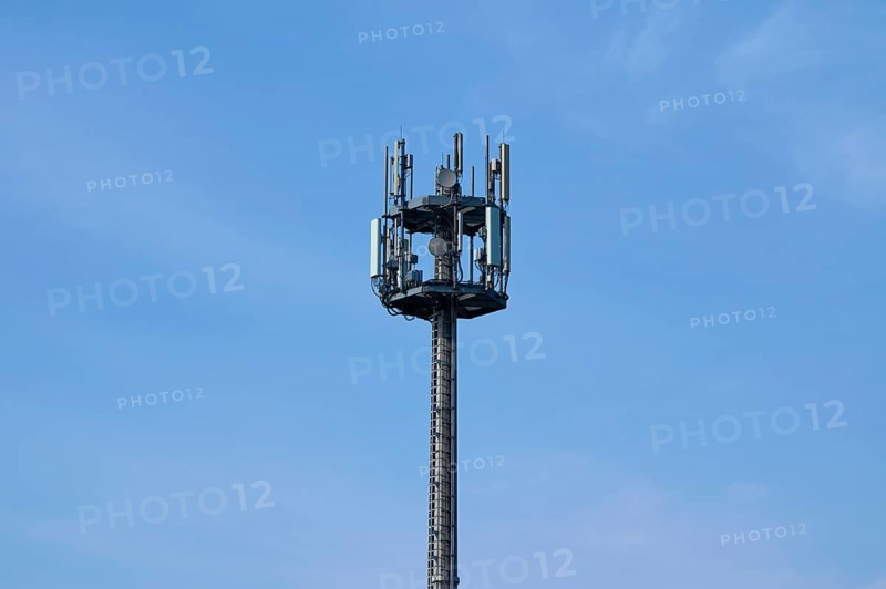 Mobile phone mast, transmission mast in front of sky, Hesse, Germany, Europe