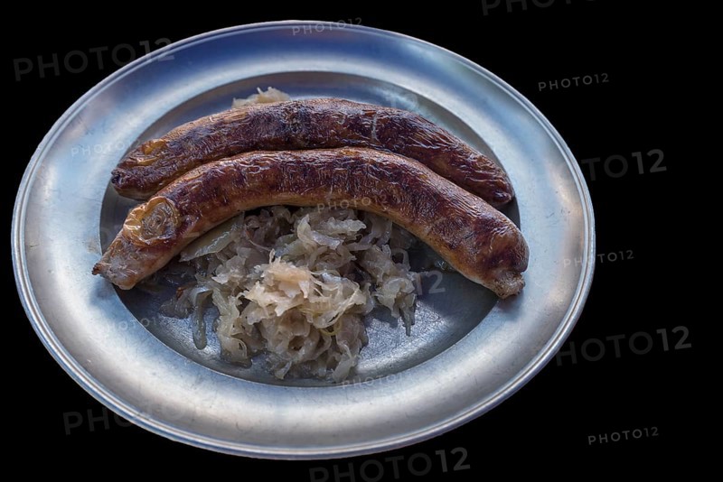 Pewter plate with two Franconian sausages and sauerkraut on a black background, Bavaria, Germany, Europe