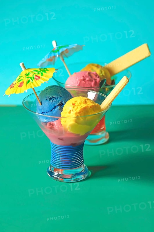 Homemade ice cream in glass bowls with waffle and umbrella, Summer, Germany, Europe