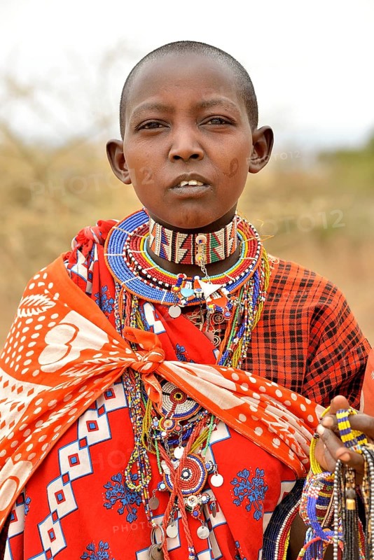 Maasai woman wearing traditional costume, Amboseli National Park, Rift Valley Province, Kenya, Africa