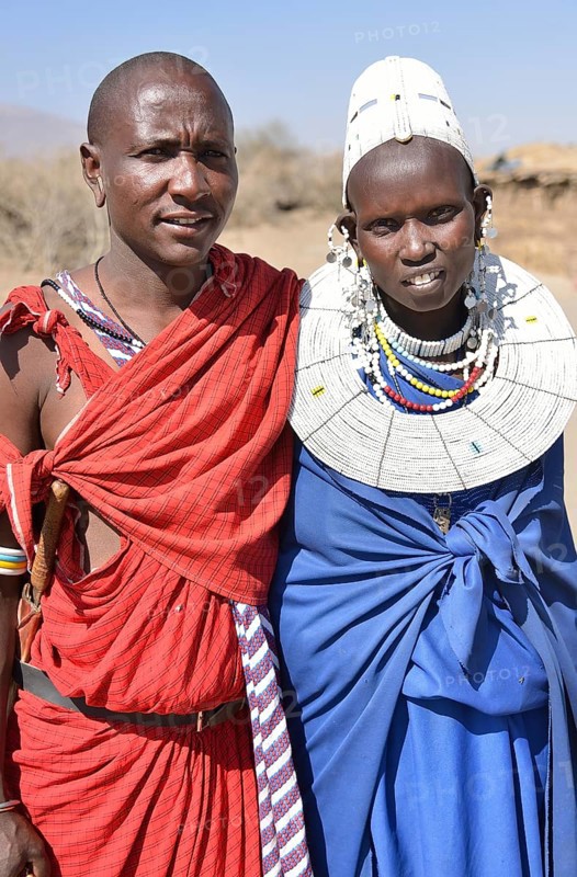 Maasai man and a woman wearing traditional dress, Ngorongoro Conservation Area, Ndema, Tanzania, Africa