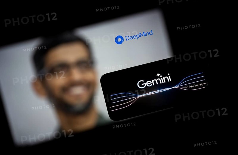 Guwahati, India. 8 December 2023. In this photo illustration a Gemini logo is displayed on a smartphone with Google CEO Sundar Pichai photo displayed in the background