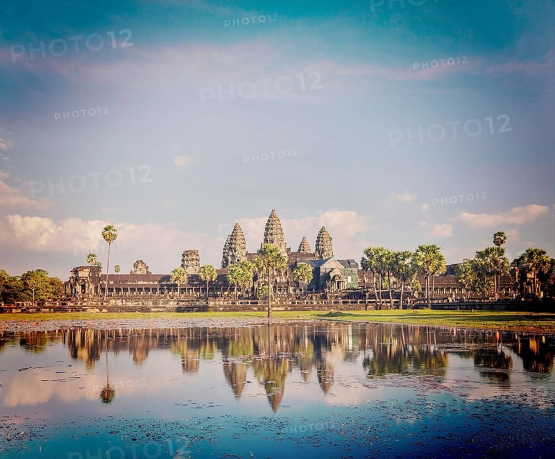 Vintage retro effect filtered hipster style image of Cambodia landmark Angkor Wat with reflection in water