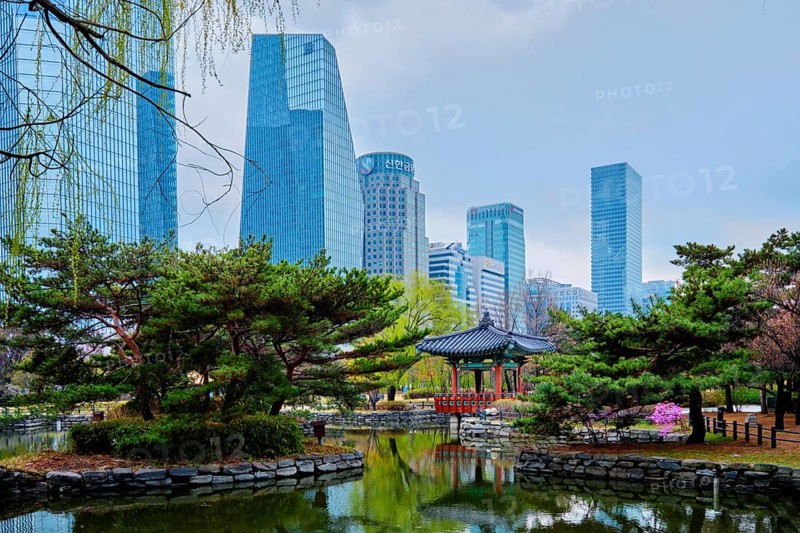 SEOUL, SOUTH KOREA, APRIL 6, 2018: Yeouido Park public park surrounded with skyscrapers in Seoul, Korea
