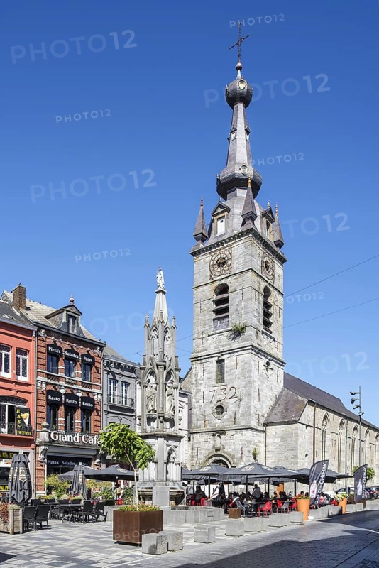 Saint Peter and St Paul Collegiate Church and Princes' fountain at Grand Place in the city Chimay, province of Hainaut, Ardennes, Wallonia, Belgium, Europe