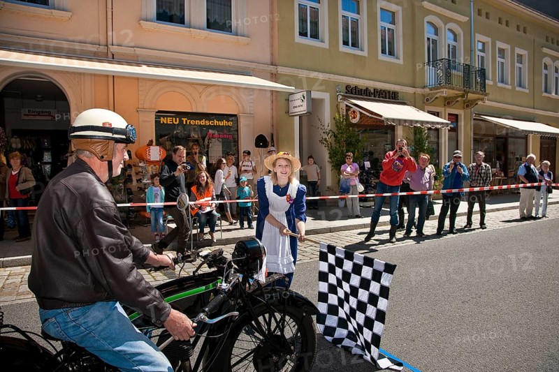 Sebnitz, town festival with classic car rally. The new flower girl Tina Häntzschel starts the motorbikes for the races