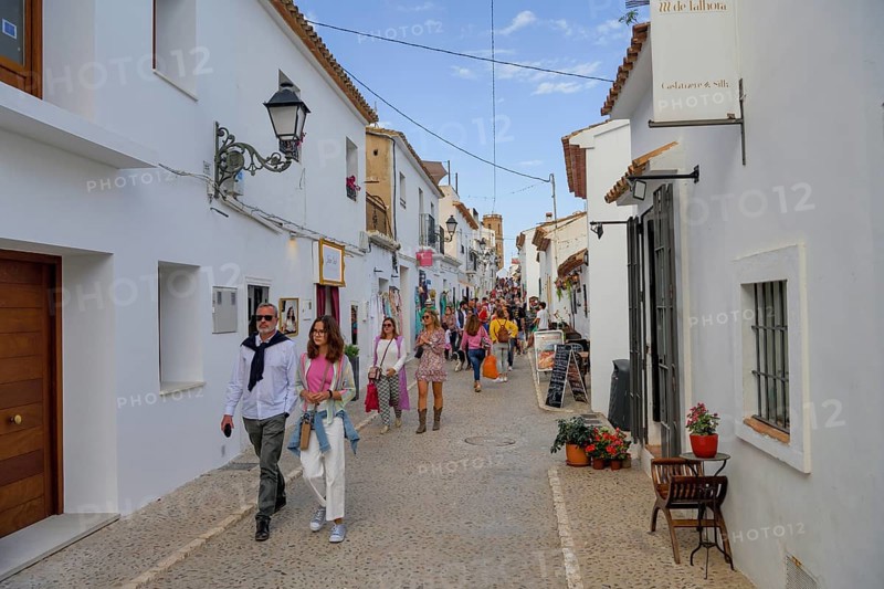 Passers-by in an old town alley, Altea, Costa Blanca, province of Alicante, Valencia country, Spain, Europe