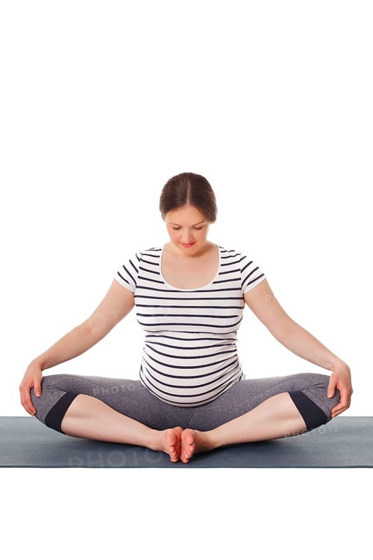 Pregnancy yoga exercise, pregnant woman doing asana Baddha Konasana Bound Angle Pose isolated on white background