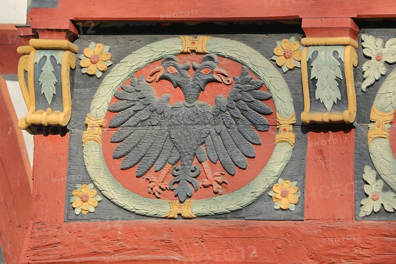 Wood carving with double eagle and floral ornaments at the historical Amthof, detail, ornaments, Bad Camberg, Taunus, Hesse, Germany, Europe