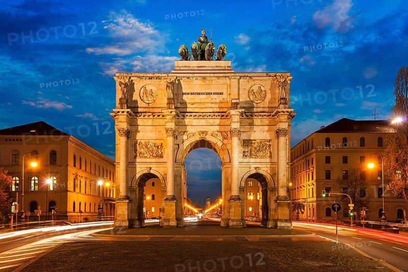 Siegestor (Victory Gate) in the evening. Motion blur of car lights because of long exposure. Munich, Bavaria, Germany, Europe