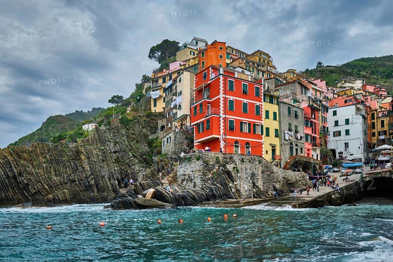 RIOMAGGIORE, ITALY, APRIL 25, 2019: Riomaggiore village popular tourist destination in Cinque Terre National Park a UNESCO World Heritage Site, Liguria, Italy in stormy weather