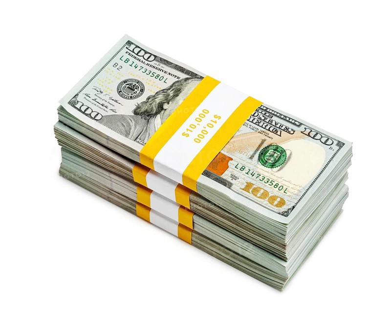Creative business finance making money concept, stack of bundles of 100 US dollars 2013 edition banknotes bills isolated on white