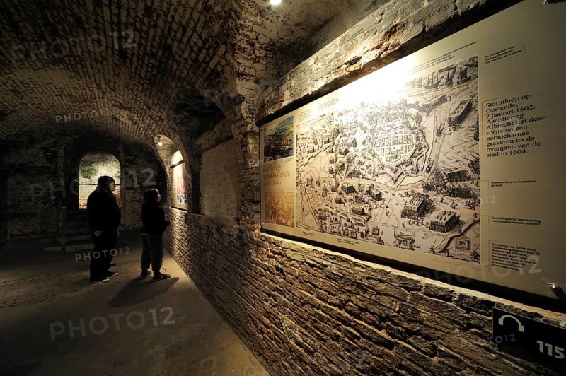 Tourists with audio guide visiting the exhibition inside the pentagonal Fort Napoleon in Ostend, Belgium, Europe