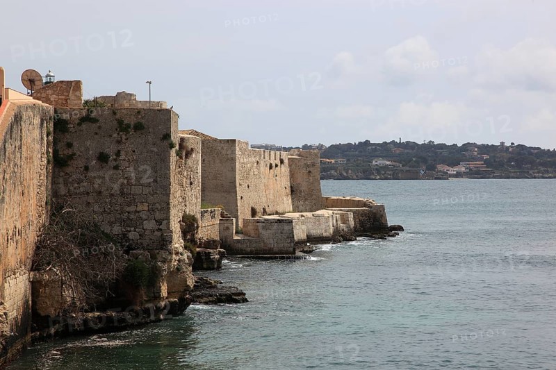 Ortygia or Ortigia is the historic centre of the city of Syracuse, the walls of the Castell by the Sea, Sicily, Italy, Europe