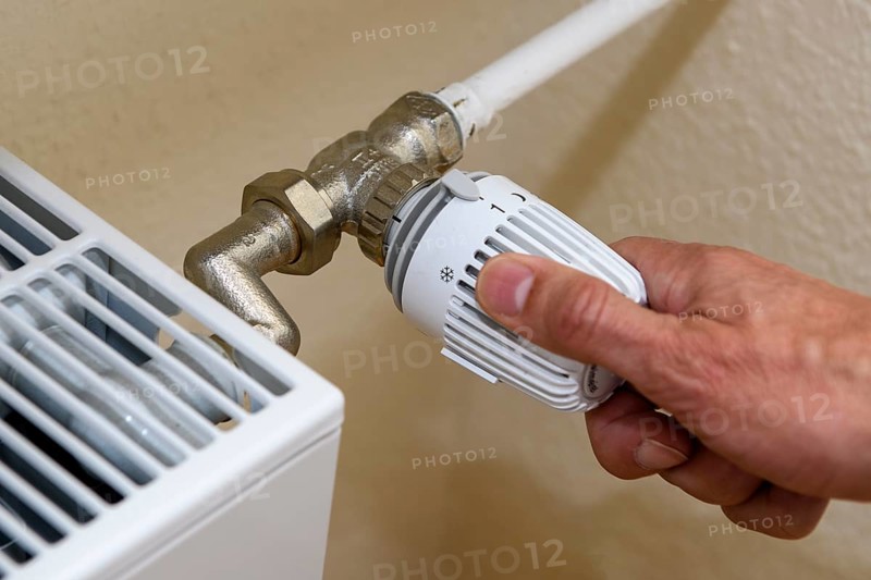 Thermostat of heating is set to low heat output level 1 for low energy consumption, setting of heating thermostat for energy saving Saving energy, Germany, Europe