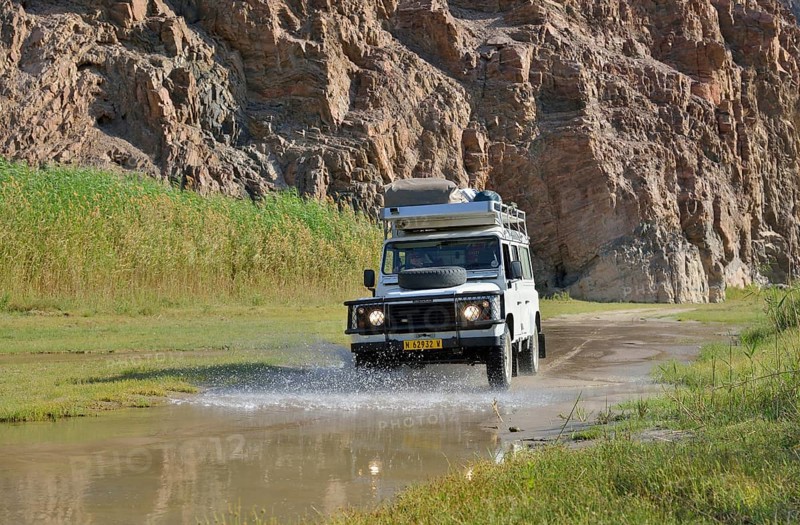 Safari vehicle in the Hoarusib river valley, Purros, Kaokoland, Kunene, Namibia, Africa