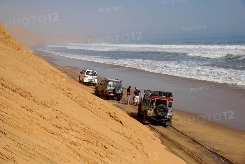 Vehicles on the Atlantic coast near Langewand, Sandwich Harbour, Namib-Naukluft Park, Namibia, Africa