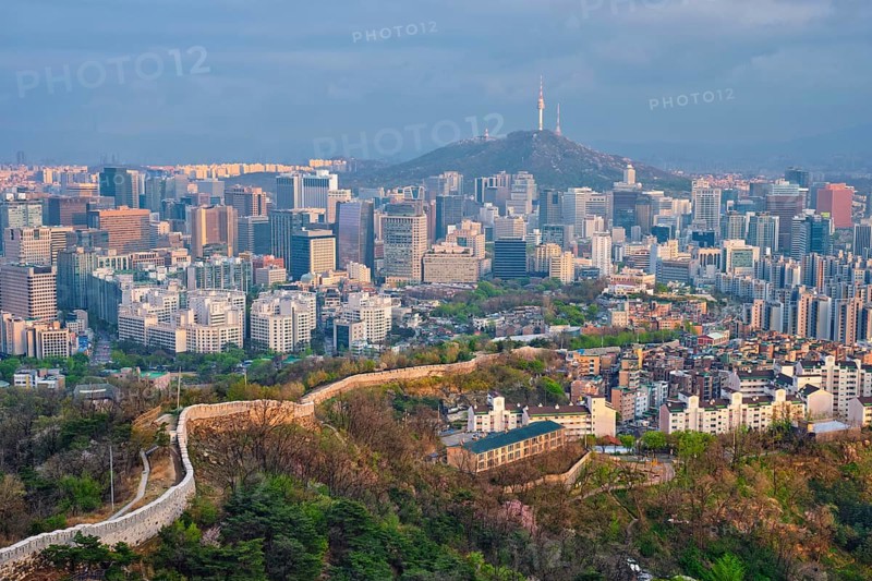 Aerial view of Seoul downtown cityscape and Namsan Seoul Tower on sunset from Inwang mountain. Seoul, South Korea, Asia