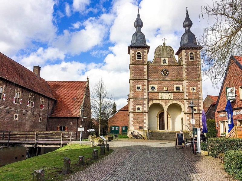 On the left bridge over moat to outer castle Raesfeld, on the right castle chapel St. Sebastian, Raesfeld moated castle, Hohe Mark nature park Park, Münsterland, North Rhine-Westphalia, Germany, Europe