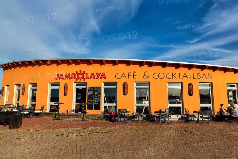 Colourful cafe, cocktail bar Jambolaya, gallery, decoration with West African handicrafts in the harbour, Barth, Germany, Europe