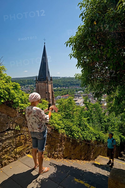 Elevated view from the Schlossberg to the church tower of St. Marien and the steep staircase into the town, Marburg an der Lahn, Hesse, Germany, Europe