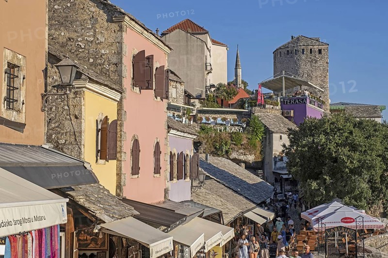 Tourists and souvenir shops in the 16th century Old Town of Mostar, built by the Ottomans, Herzegovina-Neretva Canton, Bosnia and Herzegovina, Europe