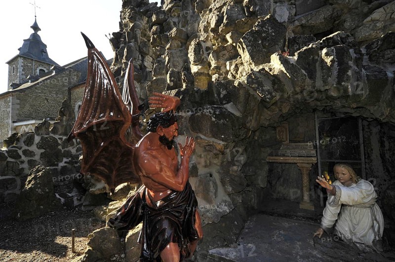 Statue of devil at the Grotto of St Anthony of Padua, Saint-Antoine de Padoue in the village Crupet, Namur, Belgian Ardennes, Belgium, Europe