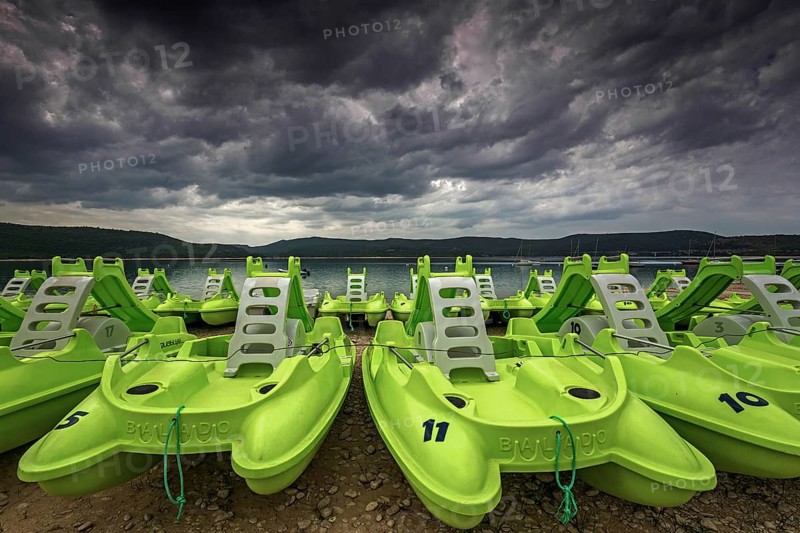 Pedal boats on the beach in Sainte Croix du Verdon, Lac de Sainte-Croix, thunderstorm atmosphere, Provence-Alpes-Côte d'Azur, Provence, France, Europe