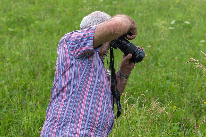 Older gentleman taking a photo, Bavaria, Germany, Europe