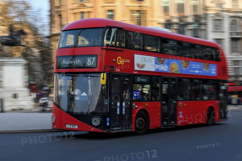 Red double-decker bus in Trafalgar Square, Westminster, London, England, United Kingdom, Europe