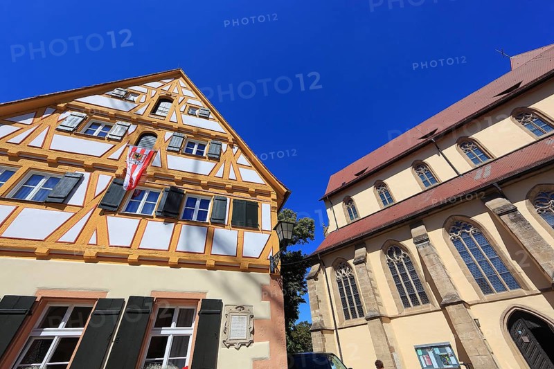 Germany, Middle Franconia, town of Weissenburg, half-timbered house (former Latin school) and the Protestant town church of St Andrew on Martin-Luther-Platz, Europe
