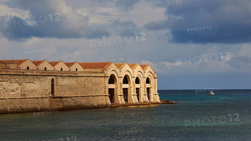 Green sea, Dark clouds, Dramatic light, Tonnara, Old tuna factory, Favignana town, Main town, Favignana, Egadi Islands, Sicily, Italy, Europe