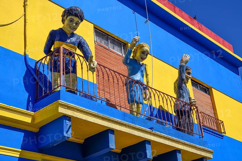 Footballer Diego Maradona, folk heroine Eva Perón and tango singer Carlos Gardel on a balcony, Caminito, La Boca district, Buenos Aires, Argentina, South America