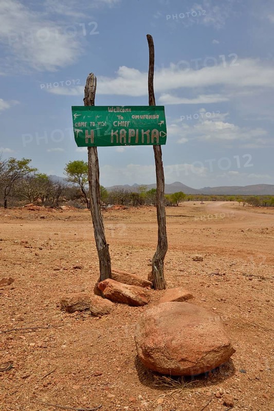Sign at the entrance to the village of Omuramba, residential village of Chief Hikuminue Kapika, the tribal leader of the Namibian Himba people, Omuramba, Kaokoland, Kunene, Namibia, Africa