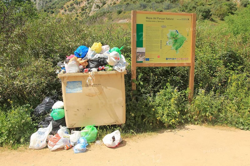 Overflowing rubbish bin at natural park, Cueva del Gato, Benaojan, Serrania de Ronda, Malaga province, Spain, Europe