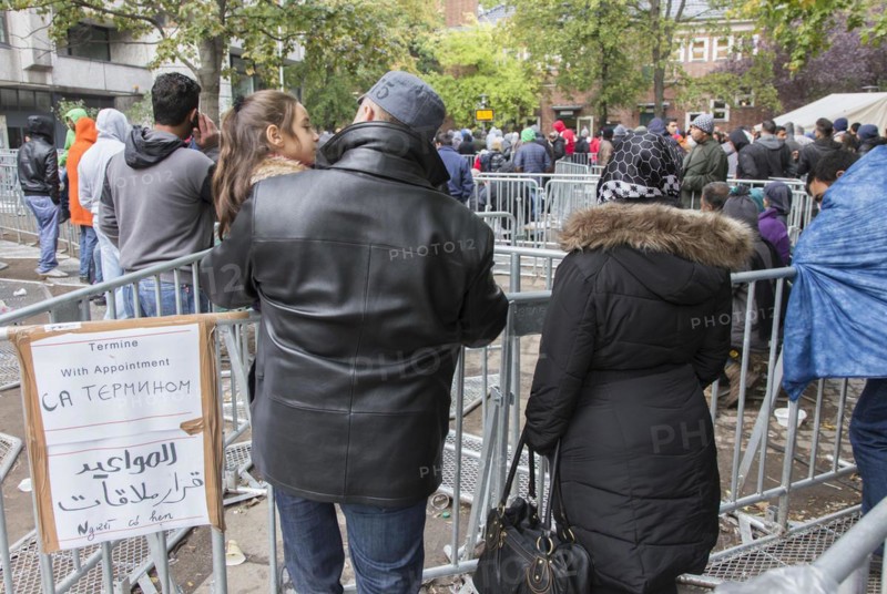 Refugees from Syria waiting to be registered at the Central Reception Centre for Asylum Seekers at the Berlin State Office for Health and Social Affairs, 09.10.2015